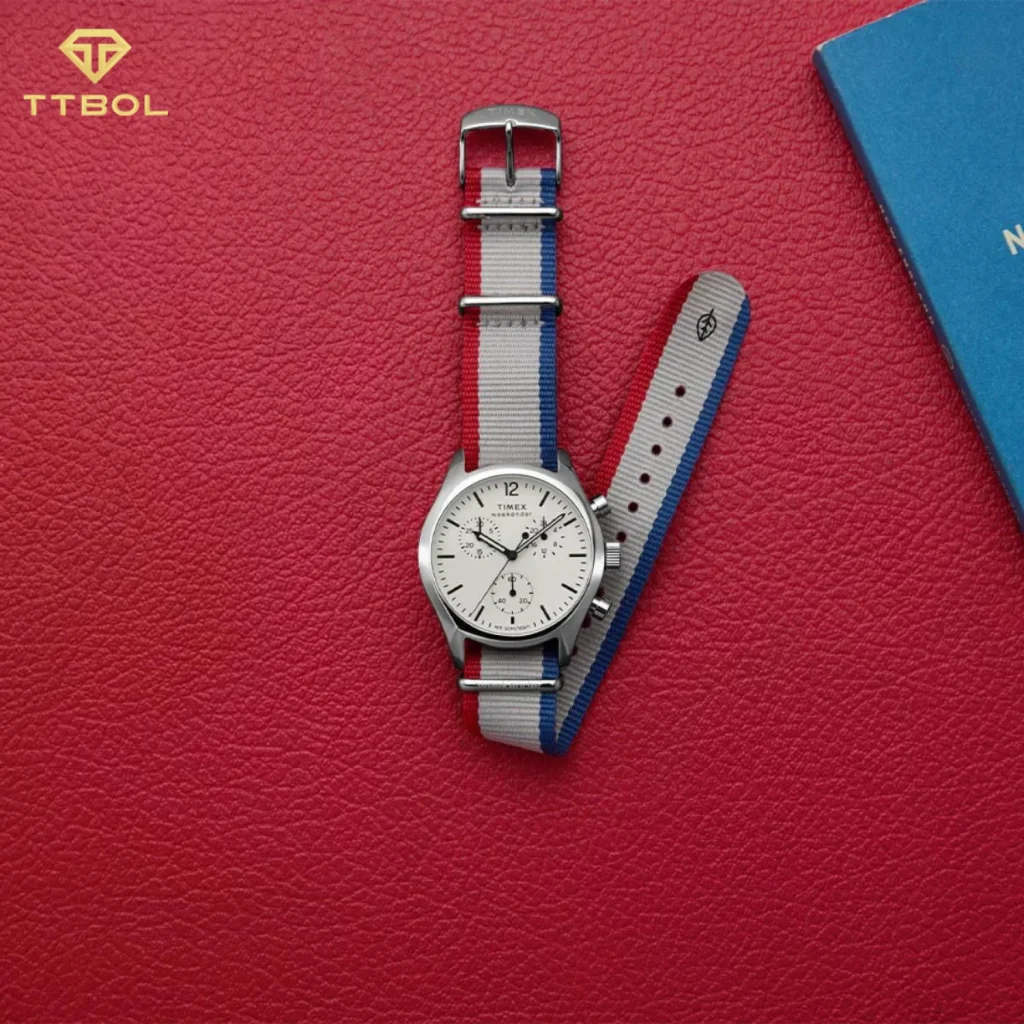 ساعت مچی مردانه تایمکس مدل TW2Y15800 Weekender New England Chronograph با صفحه سفید و بند پارچه‌ای طوسی